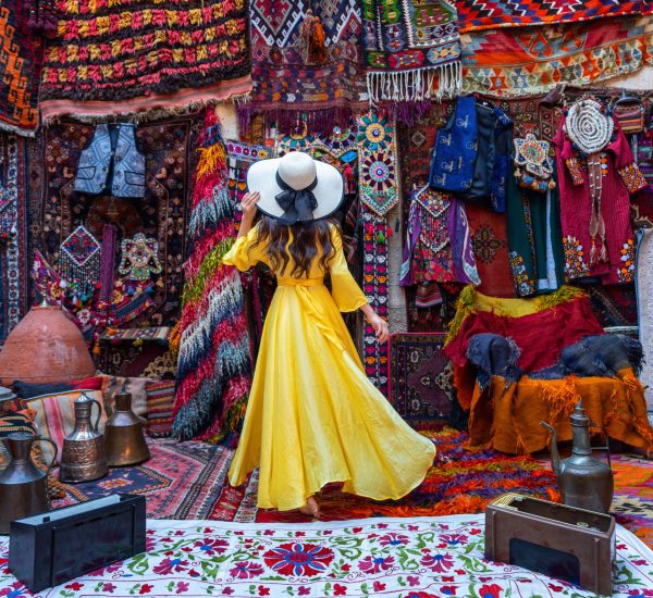 Beautiful girl at traditional carpet shop in Goreme city, Cappadocia in Turkey.